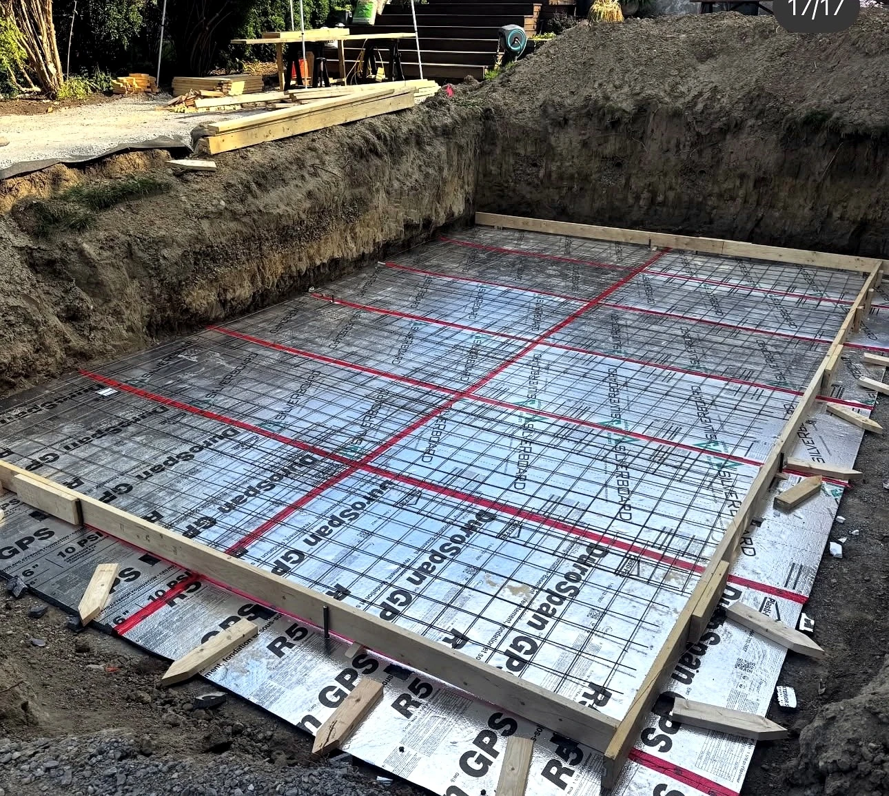 Real Pisces jobsite: rigid insulation boards with taped seams laid under the foundation